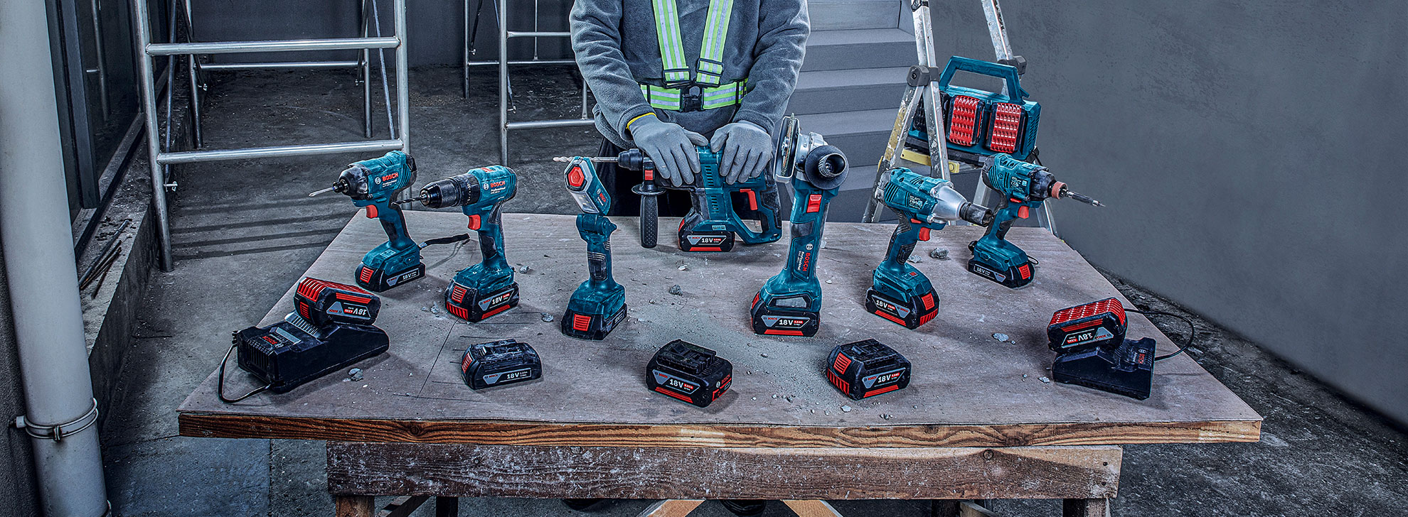 Bosch Professional tools on a table, including a cordless screwdriver, drill.