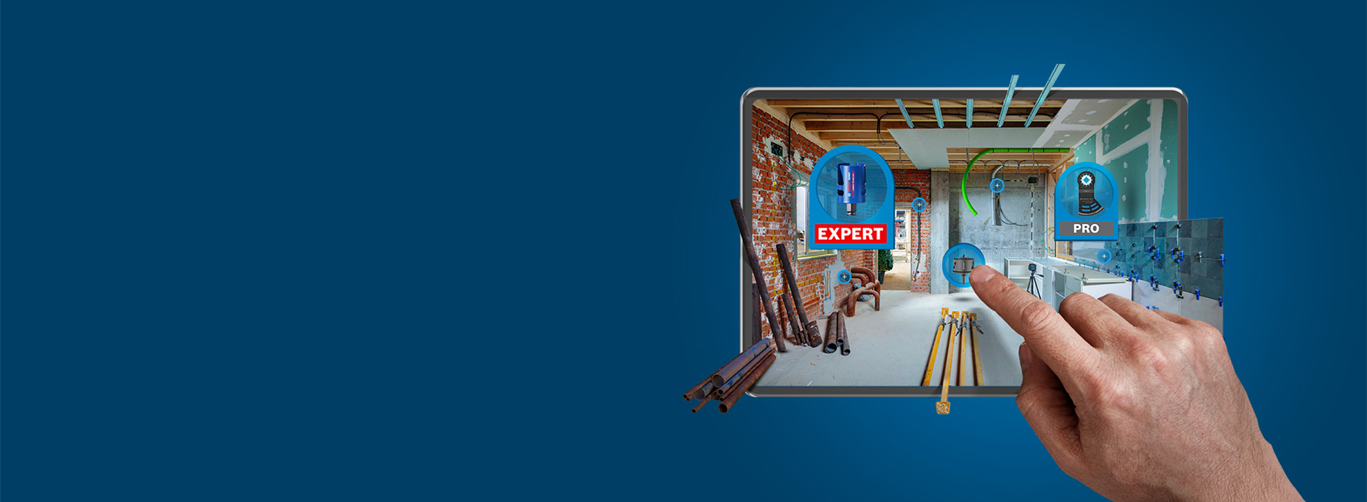 A hand touches a tablet with tools in a construction room.