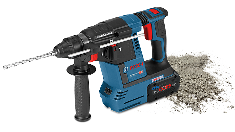 +150 A blue Bosch Professional cordless hammer lies next to gray concrete dust.